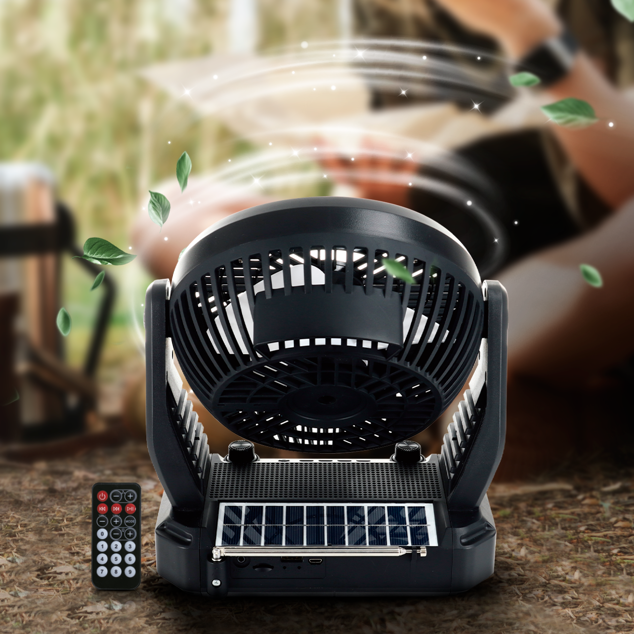 Black portable grill with remote control on a wooden surface