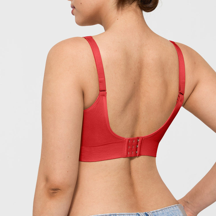 Red bra worn by a person on a light gray background