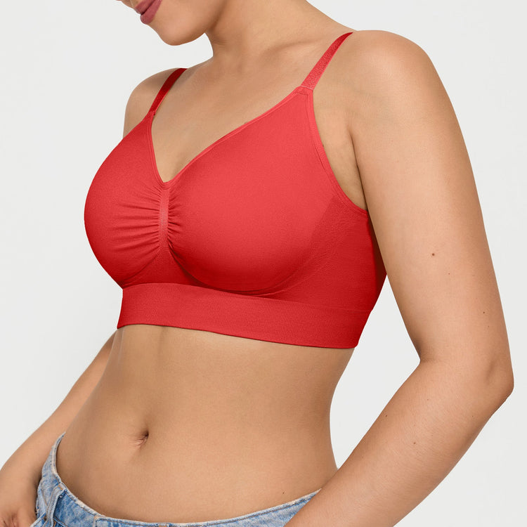 Red bralette worn by a person on a plain background
