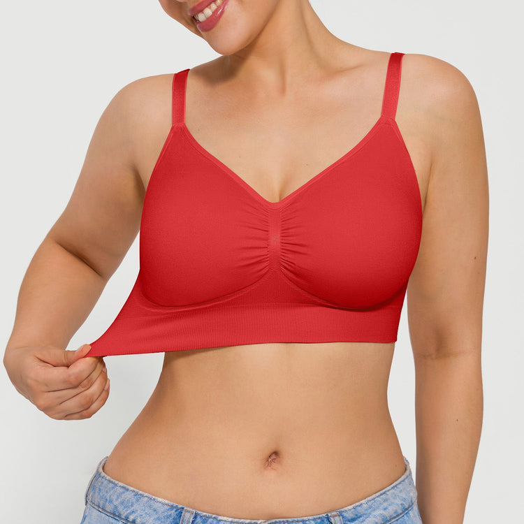 Red bra worn by a person on a plain background