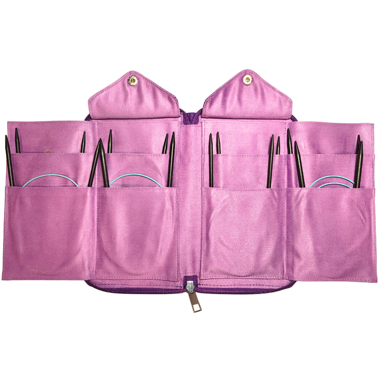 Pink knitting needle case with multiple compartments on a white background