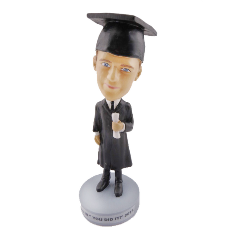 Graduation-themed bobblehead figure on a white background
