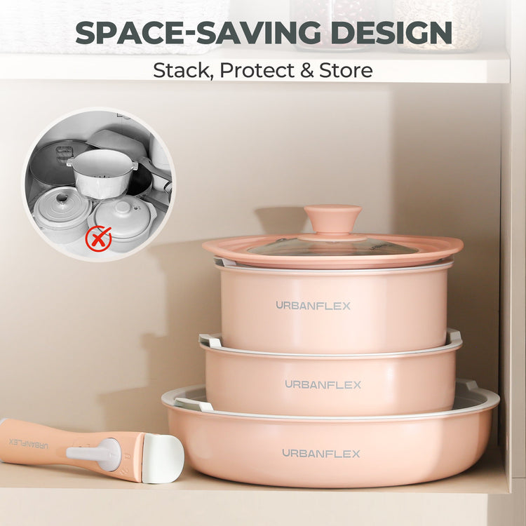 Set of pink cookware with lids stacked on a beige surface, featuring 'Urbanflex' branding.