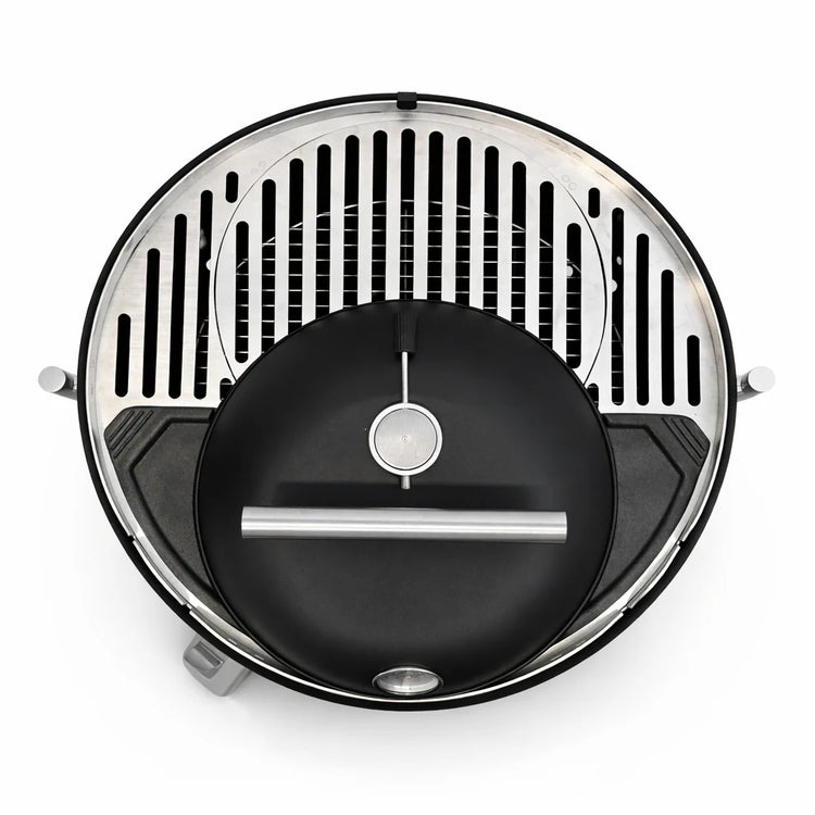 Round grill with black interior and silver exterior on a white background