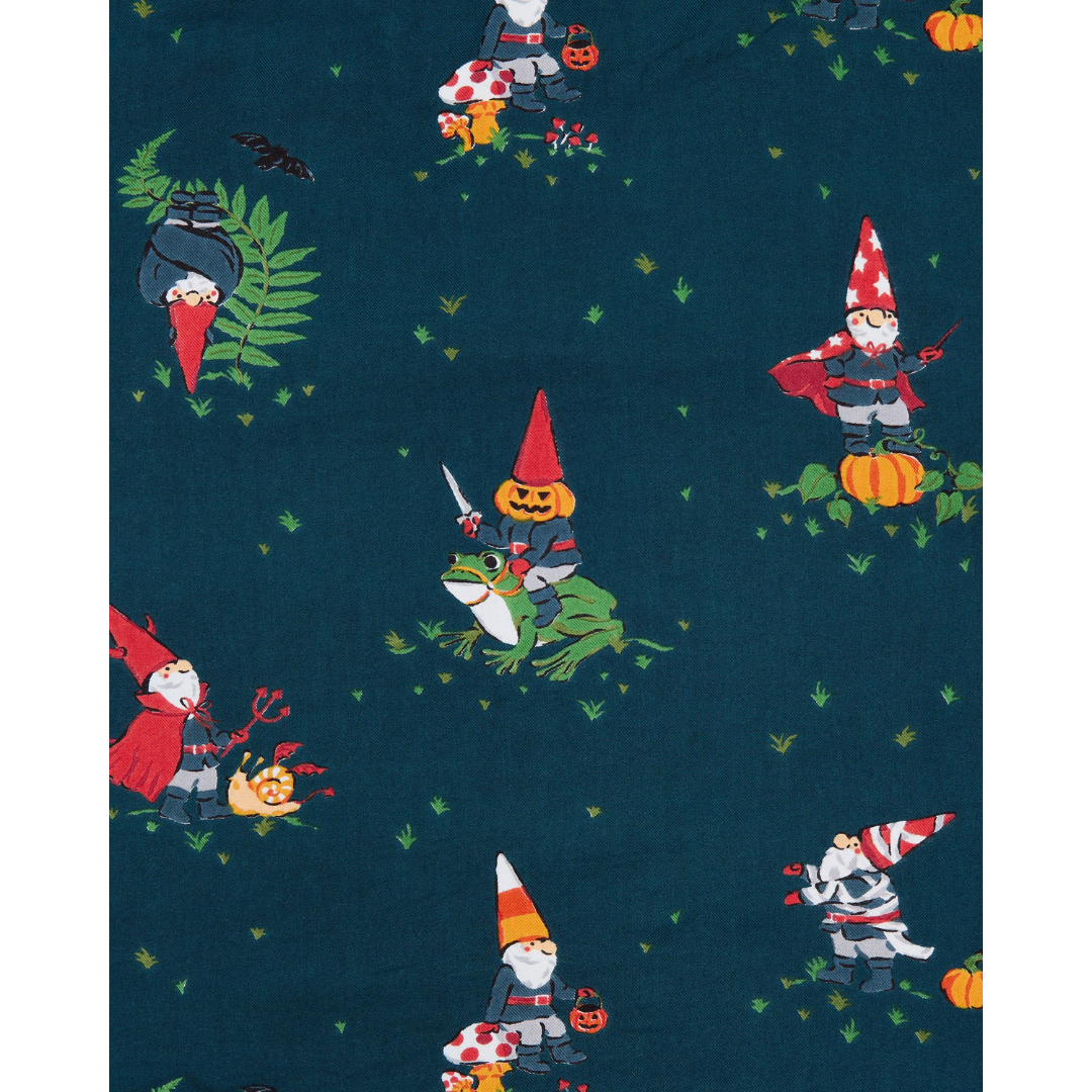 Pattern of gnomes and a frog on a dark blue background