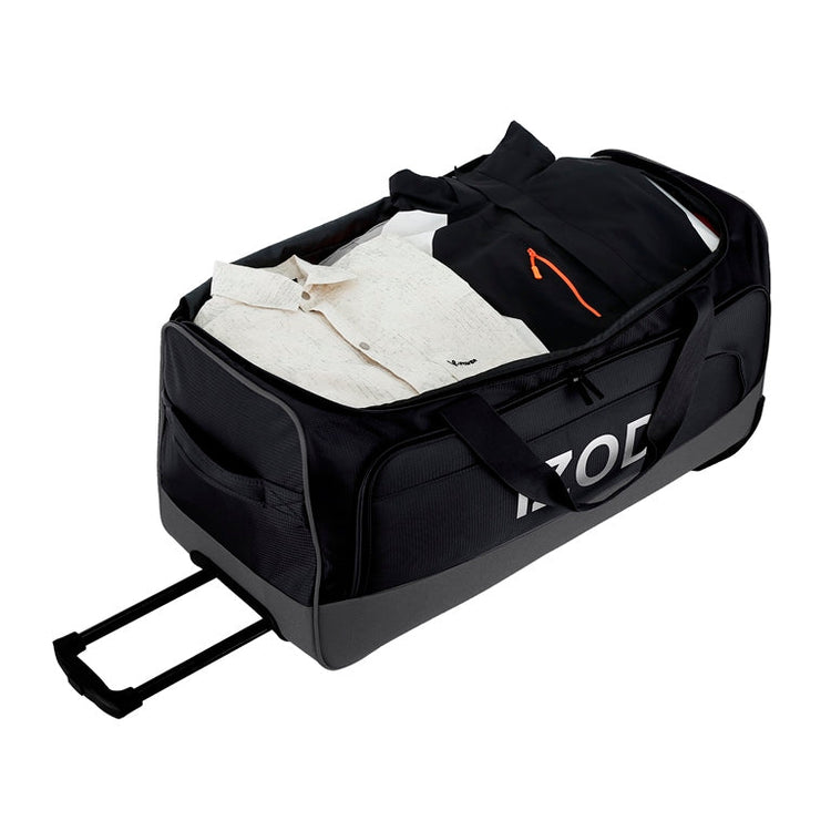 Black travel duffel bag with clothes inside on a white background