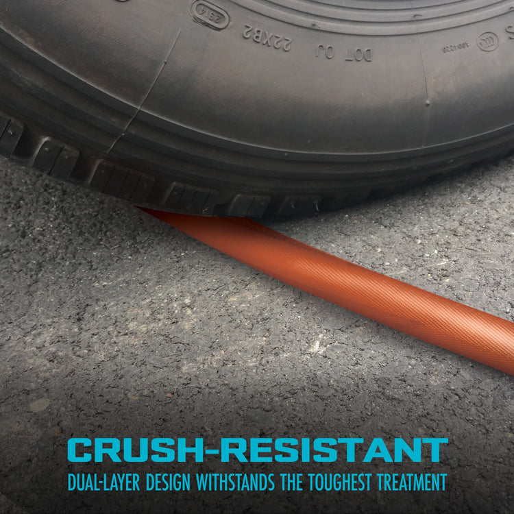 Tire with a crush-resistant hose on a concrete surface, emphasizing durability.
