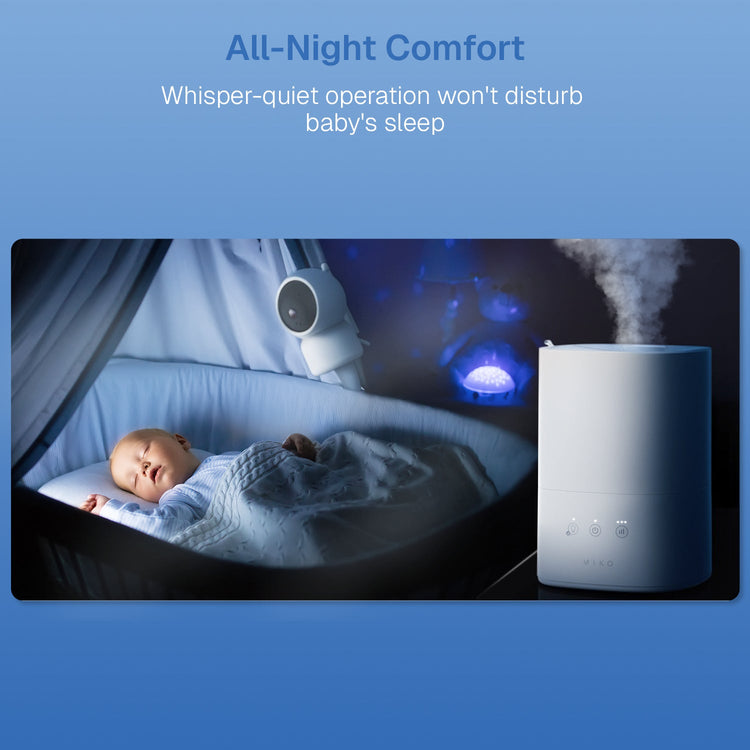 Baby sleeping in a crib with a humidifier labeled 'All-Night Comfort' on a blue background.