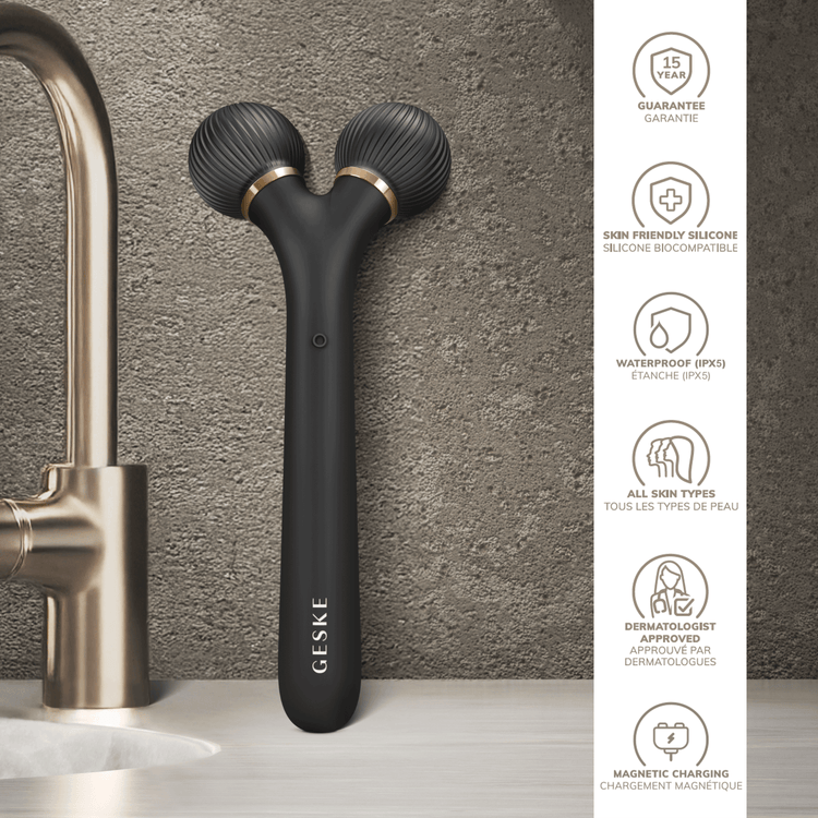 Black handheld device with 'GESKE' branding on a gray countertop next to a faucet.