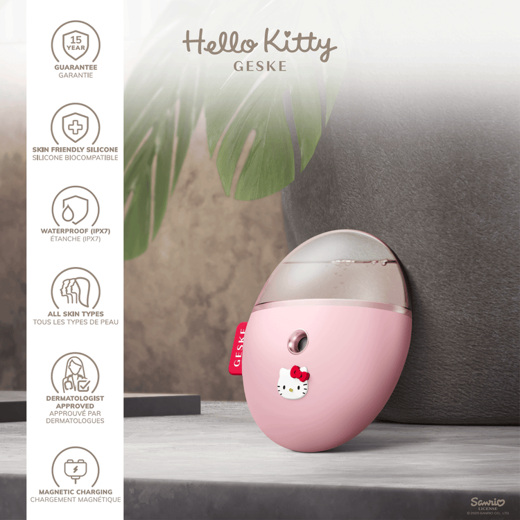 Pink and gray electronic device with Hello Kitty logo on a neutral background