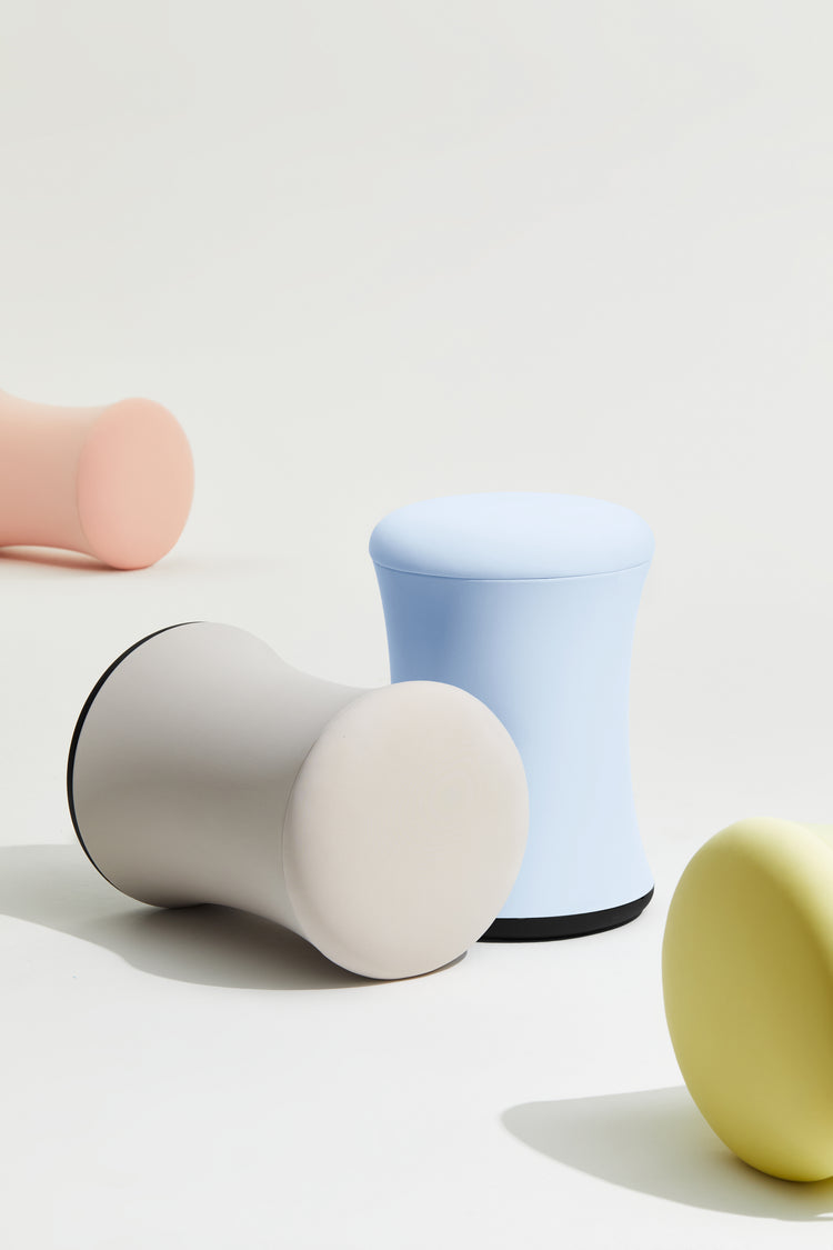 Colorful cylindrical objects on a light background