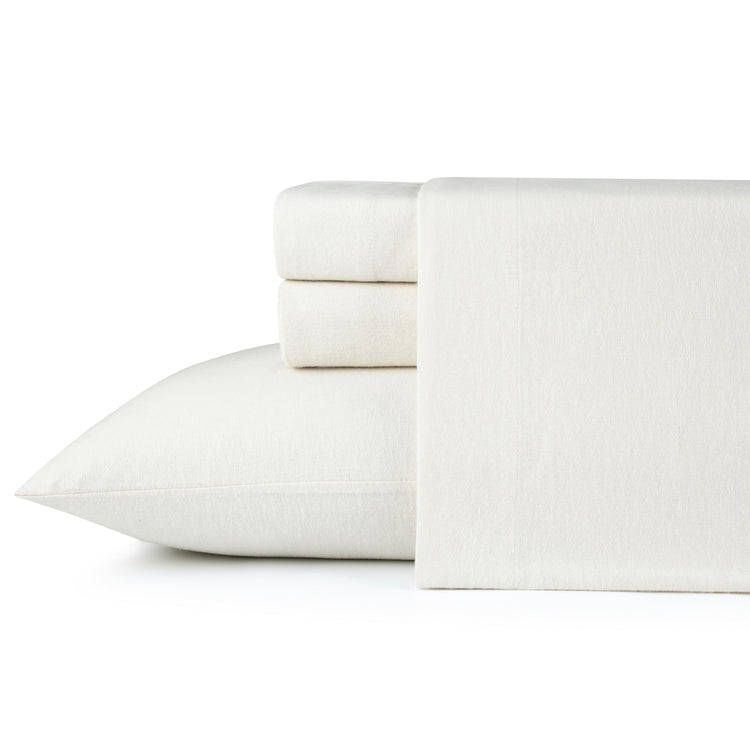 White bed sheets and pillowcase set on a white background
