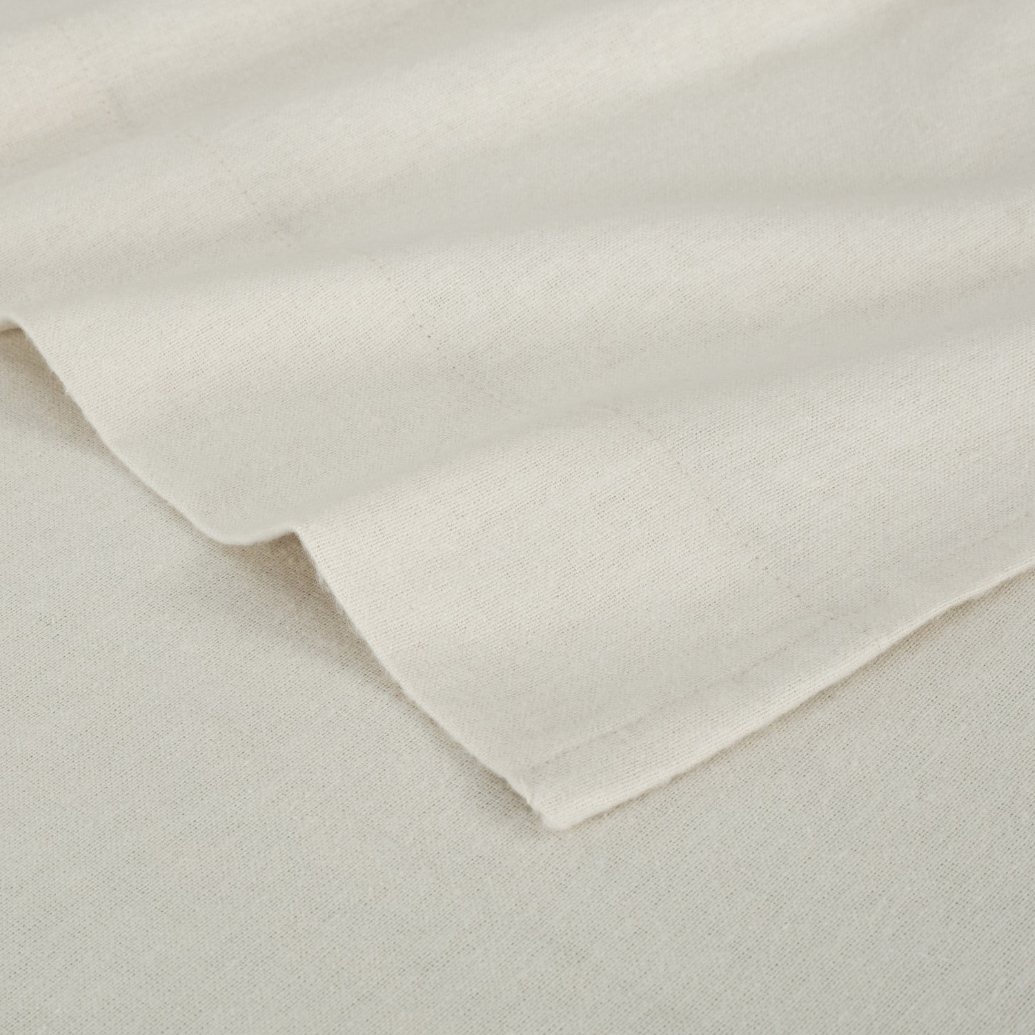 Close-up of beige fabric with a slight texture