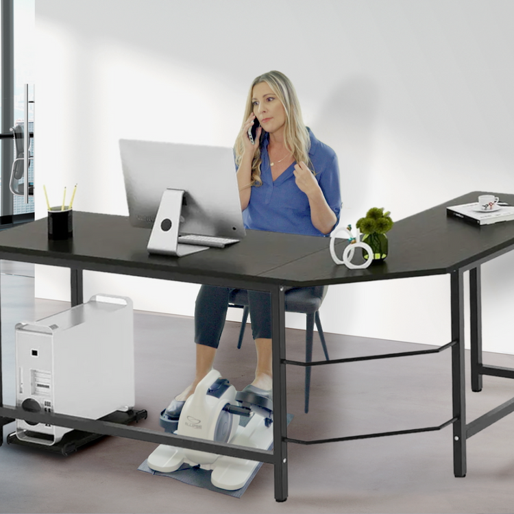 Woman sitting at a modern office desk using a phone, with a white background