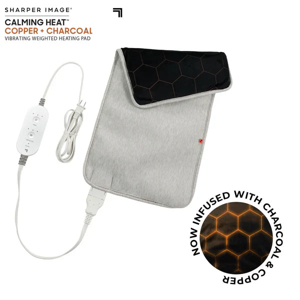 A gray calming heat pad with copper and charcoal-infused fabric, featuring a honeycomb design. It includes a control unit with a power cord and a one-touch controller for heat and massage settings.