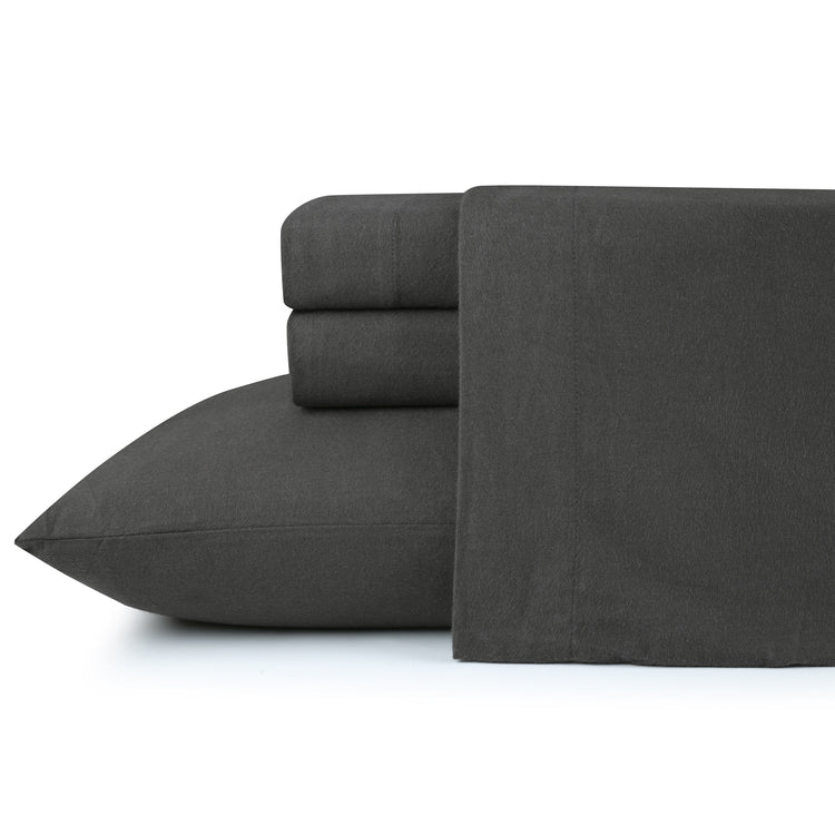 Dark gray bed sheets and pillowcases on a white background