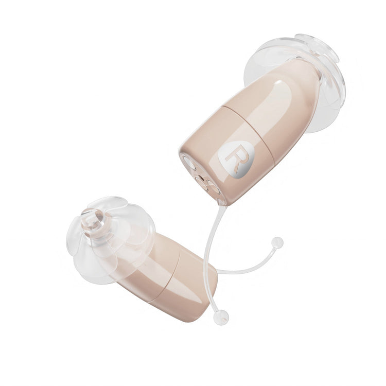 Pair of beige and clear hearing aids on a white background