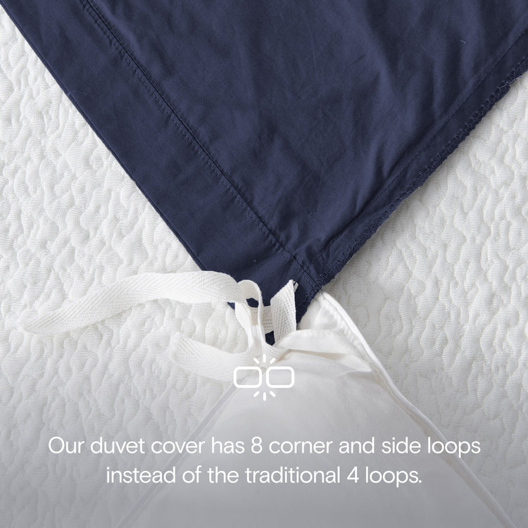 Navy blue duvet cover with white loops on a white background