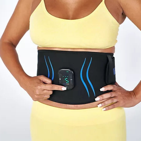 Person wearing a black waist trainer with digital display on a white background