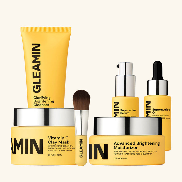 Gleamin skincare product set including cleanser, serum, oil, mask, and moisturizer on a white background.