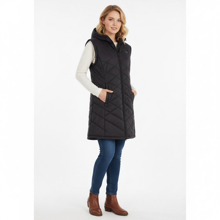 Woman wearing a black quilted vest on a white background