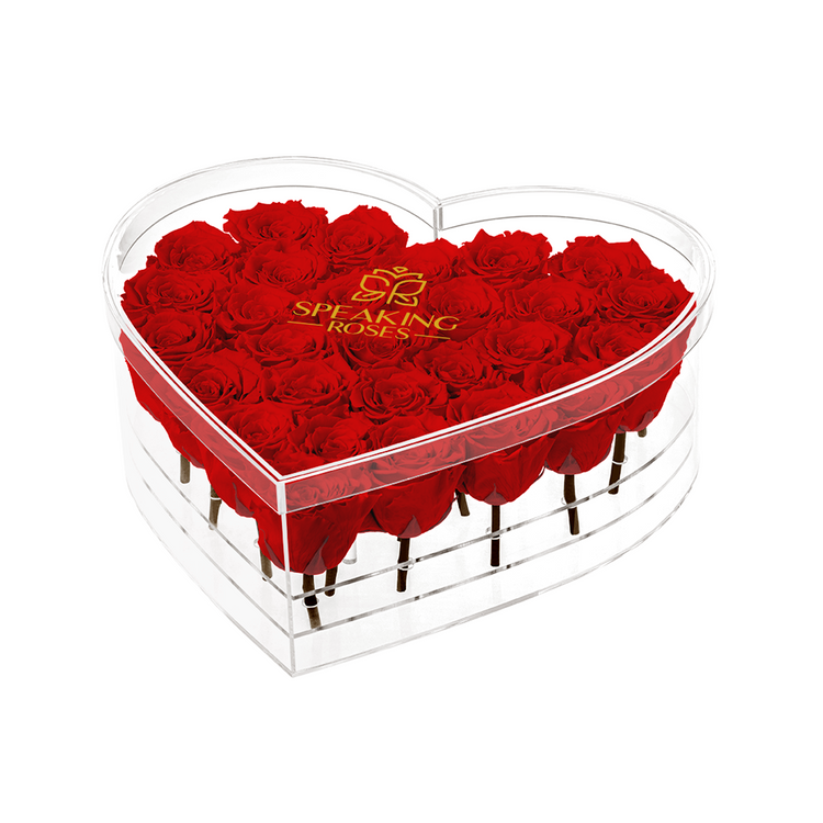 Heart-shaped box of red roses with 'Speaking Roses' logo on a white background