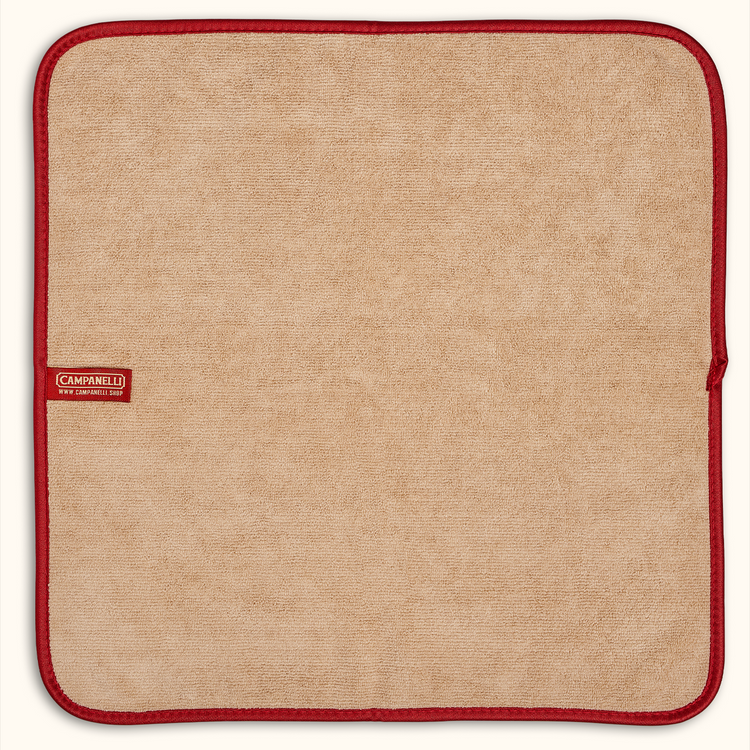 Beige fabric square with red border and Carrefour logo on a white background