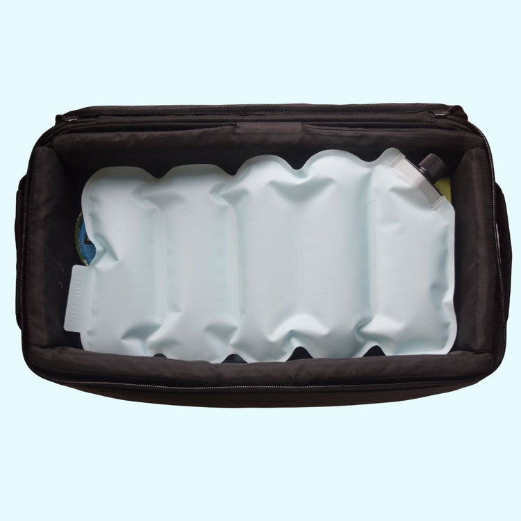Black travel bag with white ice packs on a light blue background