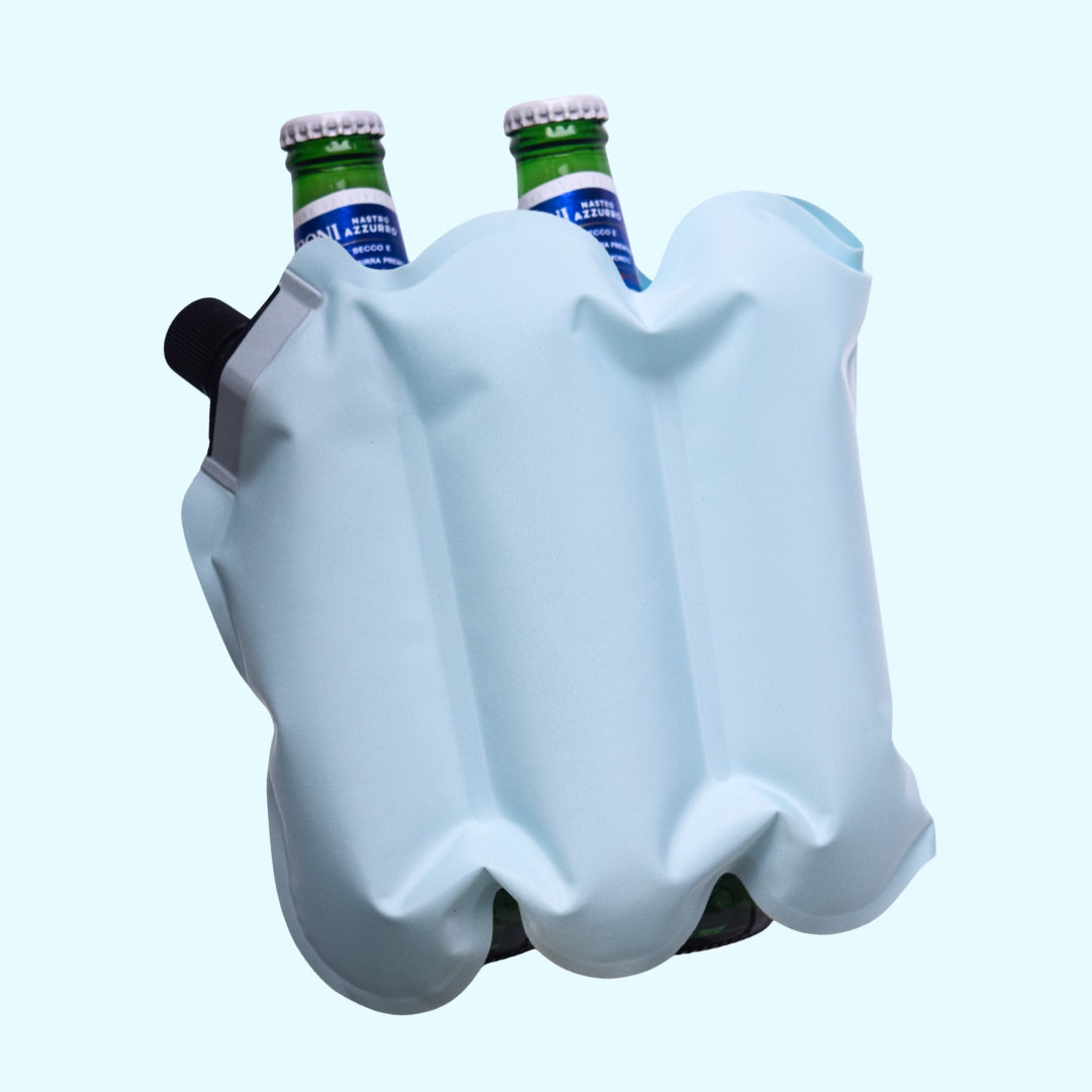White plastic bottle holder with two green bottles on a light blue background