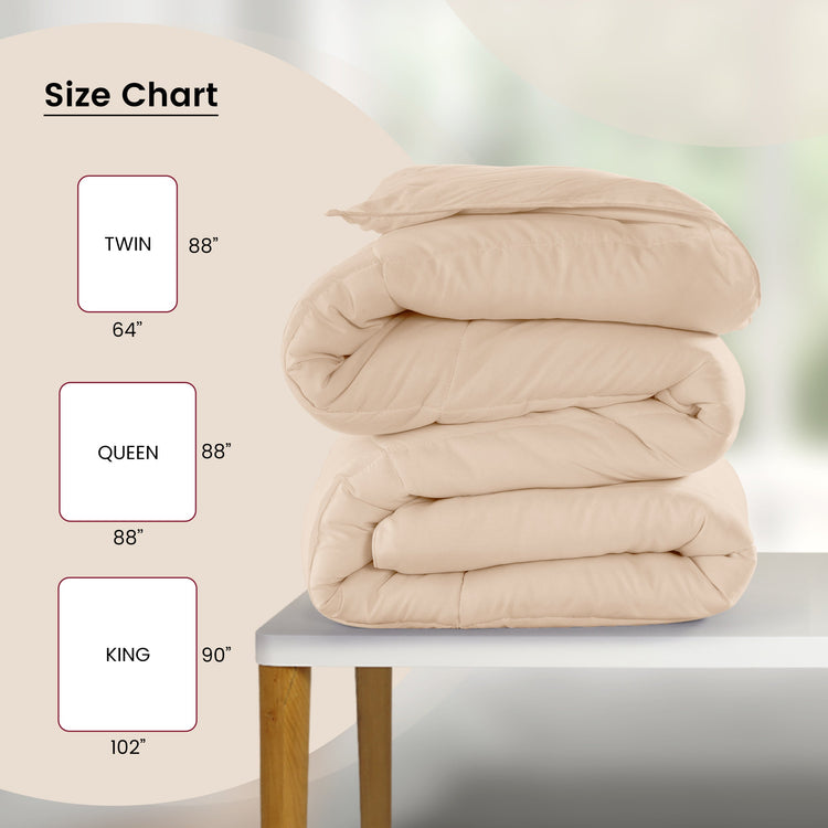 Stack of beige comforters with size chart on a light background
