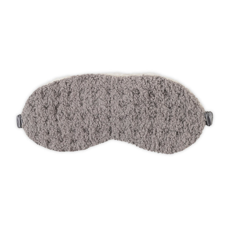 Gray textured eye mask on a white background