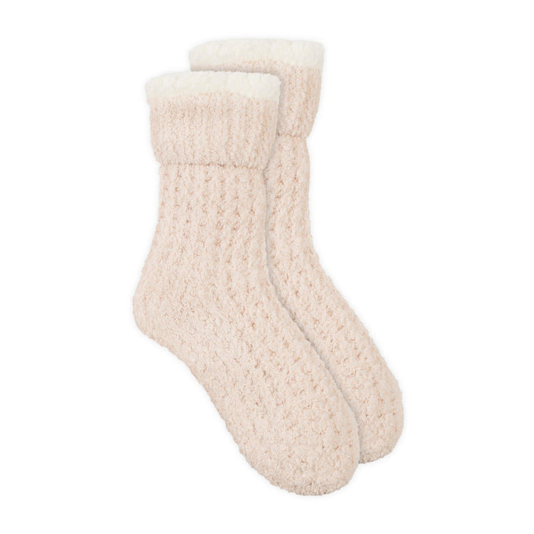 Pair of beige socks on a white background