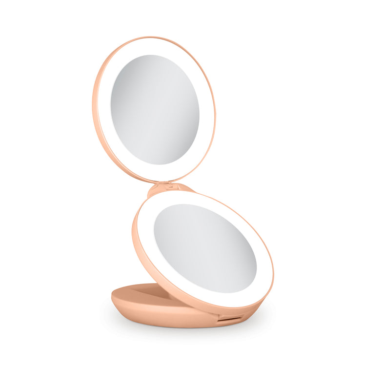 Compact mirror with a rose gold frame on a white background