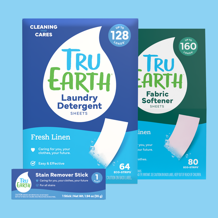 Tru Earth laundry detergent, fabric softener, and stain remover stick packaging on a blue background