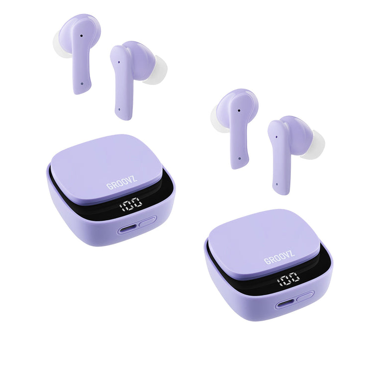 Purple wireless earbuds with charging cases on a white background