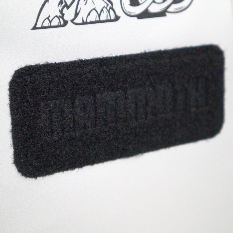 Black rectangular patch with text on a white background