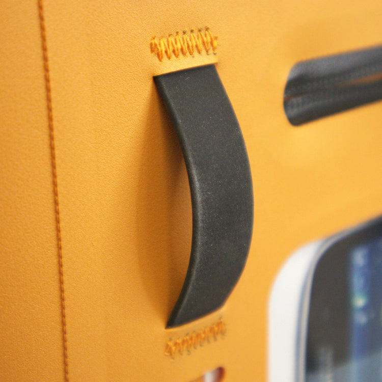 Close-up of a yellow suitcase handle with visible brand logo.