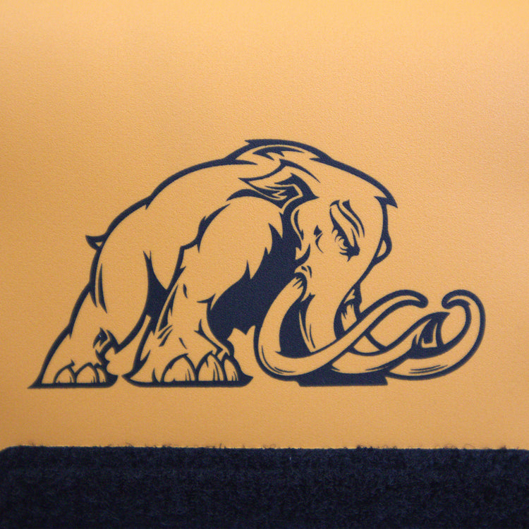 Black silhouette of a mammoth on a gold background