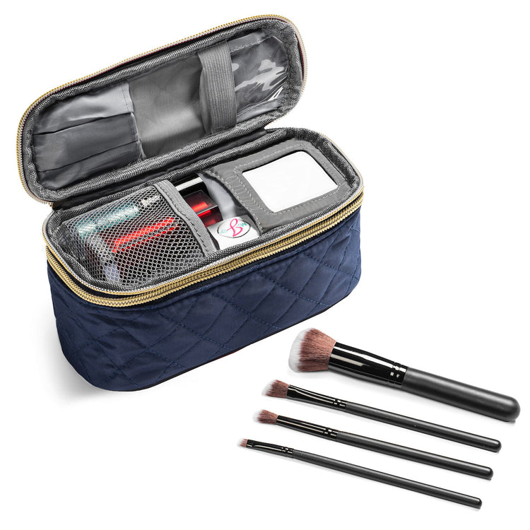Navy makeup case with cosmetic items and brushes on a white background