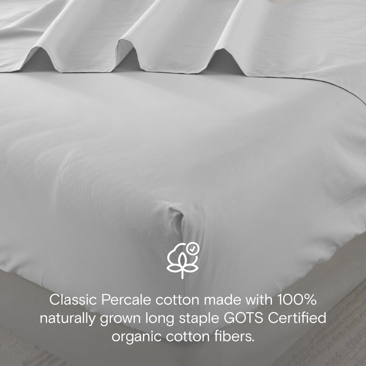 Gray percale cotton sheet set with GOTS certification logo and text.