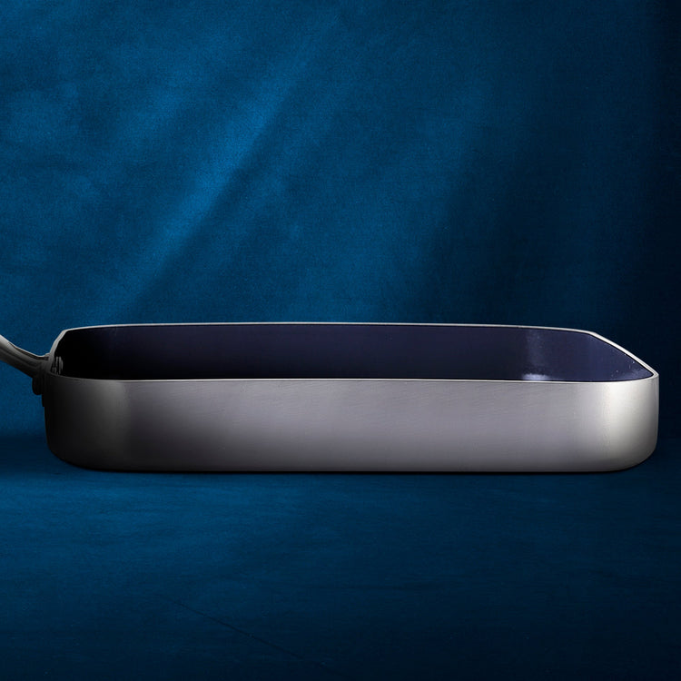 Rectangular metal pan on a blue background