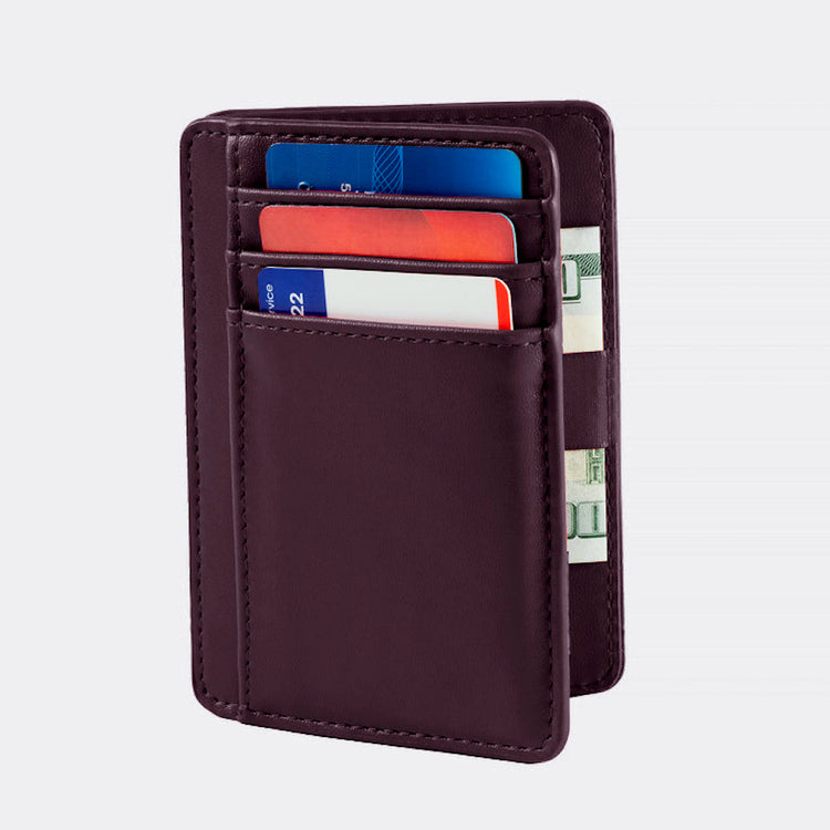 Brown leather wallet with cards and money on a light gray background