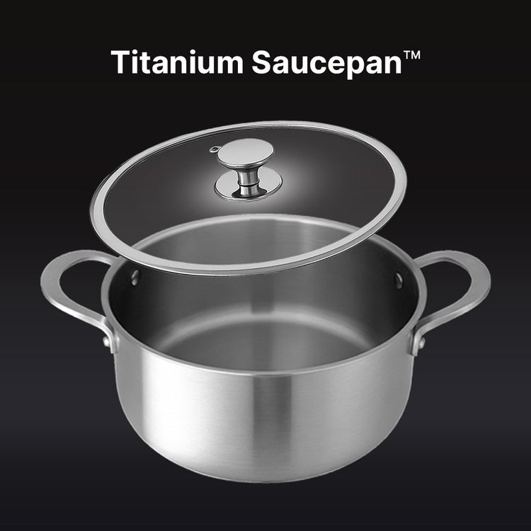 Titanium saucepan with lid on a black background