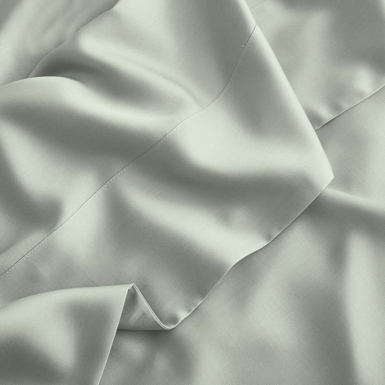 Close-up of light gray fabric with folds