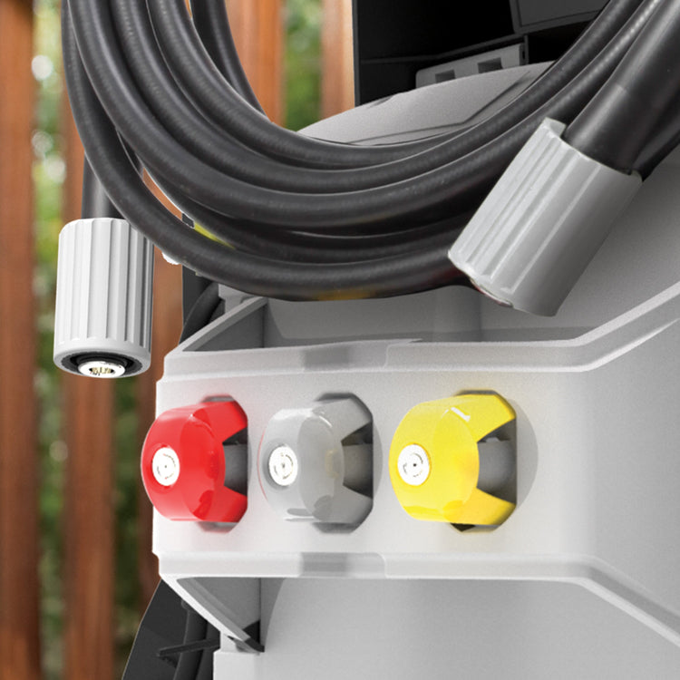 Close-up of a pressure washer with three control knobs in red, gray, and yellow, against a blurred outdoor background.