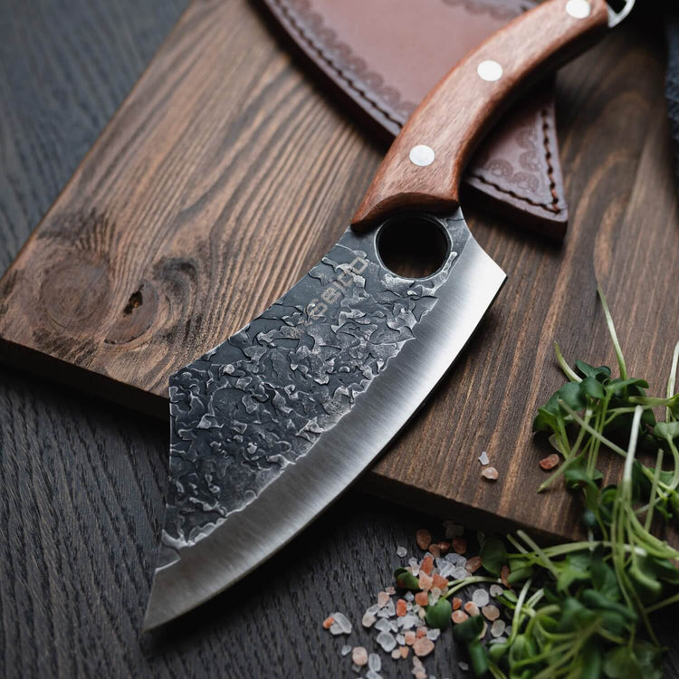 Behold the elegance of the Hakai Cleaver Knife from Seido Knives, with its wooden handle, poised on a cutting board.