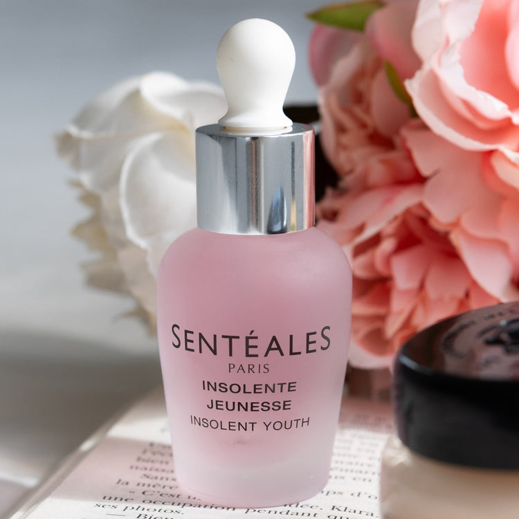 Sentéales skincare product with flowers in the background