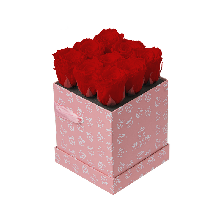 Pink box with red roses on a white background