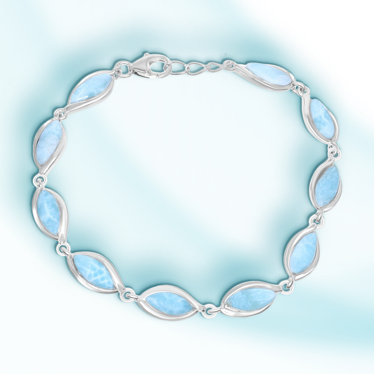 A sterling silver bracelet with marquise-cut Larimar gemstones, featuring a lobster claw clasp, against a light blue background.