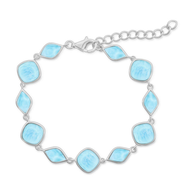 Silver bracelet with light blue gemstones on a white background